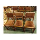 Set of six 20th century oak dining chairs, with upholstered seats and backs, raised on turned