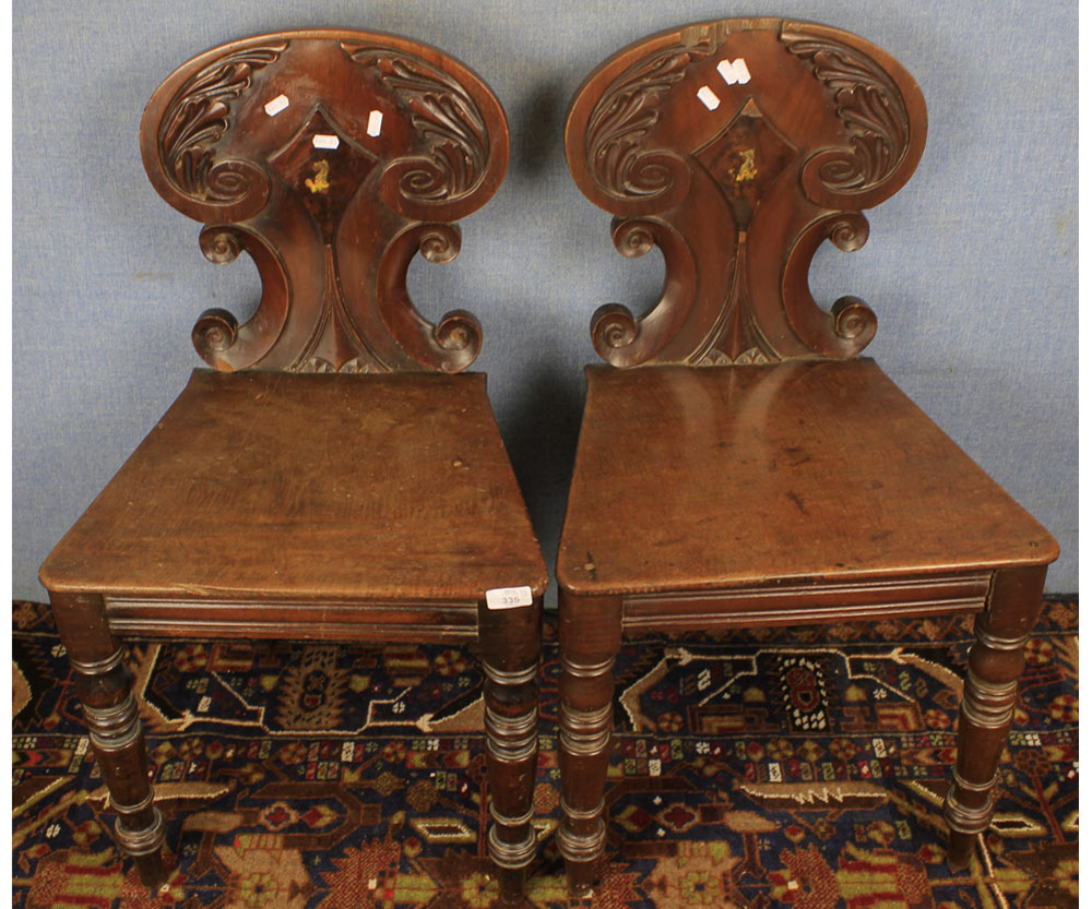 Pair of Victorian mahogany hard seat hall chairs, raised on turned front legs, 18" wide