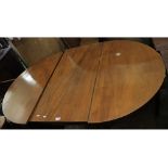 A late 18th/early 19th century mahogany D-ended dining table, centre section with two drop flaps and