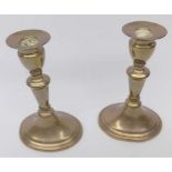 Pair of 19th century brass candlesticks with knopped stems over spreading oval bases, 7" high