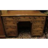 Victorian mahogany knee-hole desk or dressing table fitted with eight short drawers, raised on short