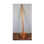 Vintage copper bed warming pan on turned wooden handle