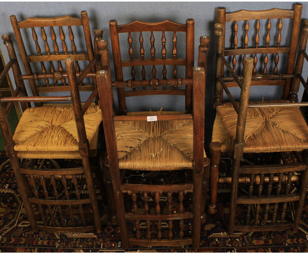 A Harlequin set of six rush-seat spindle back Lancashire type dining chairs