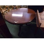 Victorian mahogany small circular dining table raised on a turned column and scrolled tripod legs