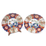 Pair of late 19th or early 20th century Imari plates, decorated with central floral panel and