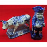 20th century Delft pottery model of a bull together with a further Delft Toby Jug, largest piece 7