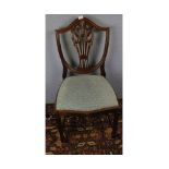 Set of four 20th century mahogany shield back dining chairs, with blue upholstered push out seats