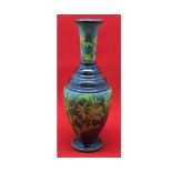 Small Royal Doulton faience baluster vase decorated with sprays of flowers, 9" high, impressed marks