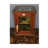 Small late 19th or early 20th century mahogany framed single door display cabinet of square form