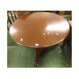 19th century round mahogany dining table, the top raised on a tapering pedestal over three paw-