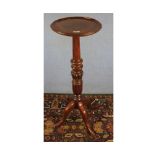 Mahogany torchere plant stand raised on turned column and quatre base