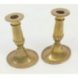 Pair of brass candlesticks of knopped form with spreading oval base, 6" high