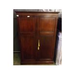 Early 20th century Maple & Co mahogany two door hall cupboard, with rail and shelf interior, 40"