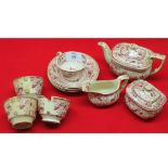 19th century doll's part tea service comprising tea pot, sugar basin, milk jug and quantity cups and