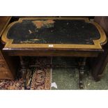 Victorian walnut writing table, the shaped top with inset leather raised on fluted supports and