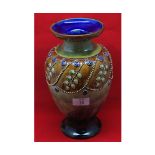 Large Royal Doulton stoneware baluster vase decorated with floral swags, marked to base "3307",