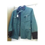 German, WWII type police tunic, of brown and green wool felt, with applied cloth badge