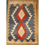 Kilim small rug and prayer mat each decorated with geometric designs on turquoise and beige ground