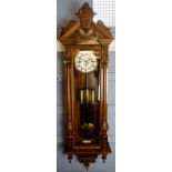 Late 19th century walnut and further decorated Vienna type triple weight wall clock, the