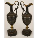 Pair of late 19th century patinated and lacquer brass clock side pieces, each modelled in the form