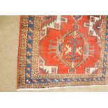 Caucasian runner with triple gull border and central panel of interlinked lozenges mainly red,