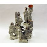 Staffordshire figure of a Highlander standing beside a cannon, further group of man and woman with