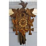 Late 19th century "Black Forest" stained pine wall mounted cuckoo clock, the architectural case with