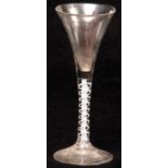 18th century wine glass with drawn trumpet bowl, opaque spiral twist stem and spreading circular