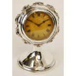 First quarter of 20th century silver cased desk timepiece, circular case with cast and applied C-