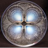 Lalique opalescent dish of circular form decorated with the "Coquille" design, the centre marked "