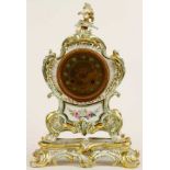 A first half of the 19th century Paris porcelain mantel clock, the waisted case on a separate base