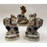 Pair of Staffordshire models of probably Royal children seated on dogs, each with birds on their