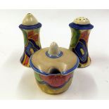 Clarice Cliff three piece cruet, comprising salt, pepperette and lidded mustard, decorated with