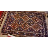 Caucasian rug with triple gull border, central panel of interlinked lozenges mainly blue and beige/