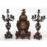 Late 19th century French cast and gilt brass and Champlev clock garniture, the waisted case with