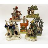 Collection of seven various Staffordshire groups, spill vase groups etc including a tithe pig and