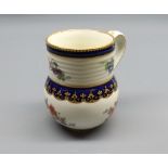 19th century Derby mug decorated with floral sprays and pseudo gold anchor mark to base, 4" high