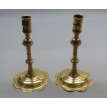 Pair of 18th century brass candlesticks of knopped form with spreading circular bases, 8" high