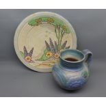 Mixed Lot: Crown Devon wall plate Pattern No M474, 12" diameter, and a further Bourne Denby jug (2)