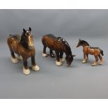 Two Beswick brown Shire Horses and foal, largest piece 8 1/2" high (3)