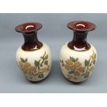 Pair of Lovatt 8" high stoneware vases, decorated with floral sprays