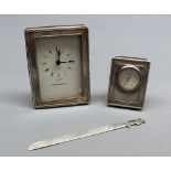 Two small silver framed bedside clocks by Arthur Price of England and a further white metal paper