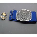 Silver oval Royal College of Nursing badge, together with a further base metal nurse’s belt buckle