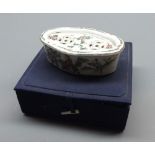 Chinese small oval covered box, the recessed lid inset with pierced panels and the body decorated