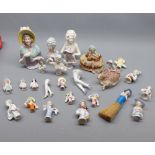 Collection of various late 19th and early 20th century ceramic pin cushion dolls and others, largest