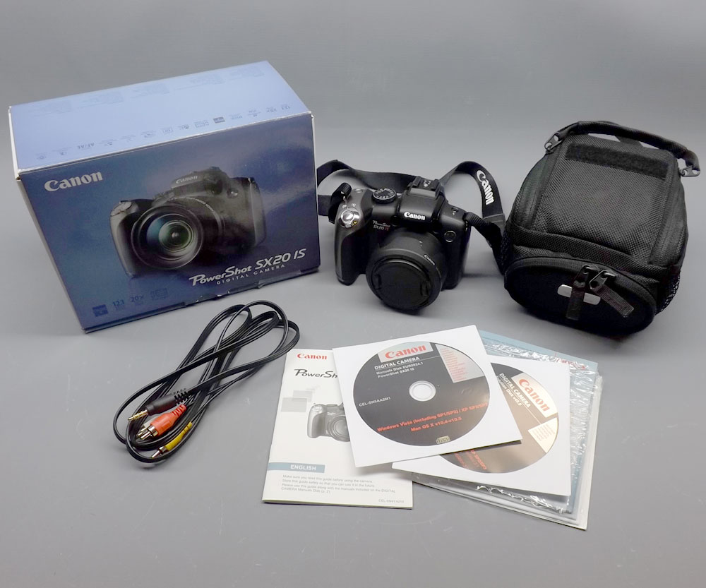 Canon Digital Powershot SX2015 digital camera with disks and leads together with Ever-ready case