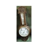 Late 19th or early 20th century oak framed aneroid barometer/thermometer combination