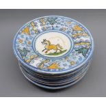 Set of six small Majolica plates, decorated with central horse motif, 7 ½” diameter