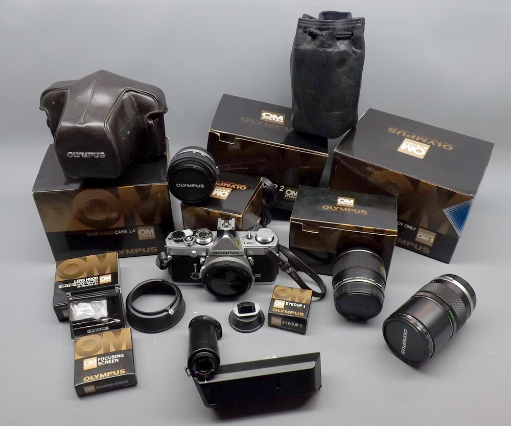 Mixed lot: Olympus (OM1N) 35mm camera with accessories to include F.18 lens, semi-hard case, Zuiko