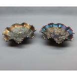 Near pair of dark carnival glass frilled dishes decorated with grape and vine leaf detail, 9”